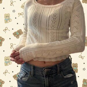 Self-Esteem Cream and white knit sweater